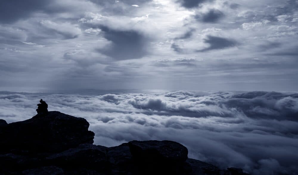A cairn marking a backlit path